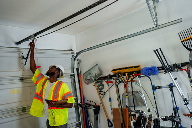 Professional Garage Door Spring Repair technician working in Delmont, PA